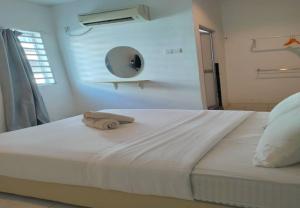 Postel nebo postele na pokoji v ubytování 1108 Hotel Sungkai