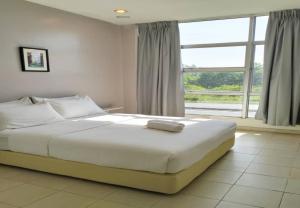 Postel nebo postele na pokoji v ubytování 1108 Hotel Sungkai