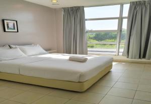 Postel nebo postele na pokoji v ubytování 1108 Hotel Sungkai