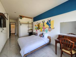 TV a/nebo společenská místnost v ubytování Hepi Yuk Ubud Luxury Guesthouse