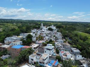 an aerial view of a town with white houses at cabaña la bonita habitacion 302 in Doradal