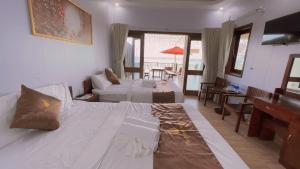 Postel nebo postele na pokoji v ubytování The Poplar Resort Phú Quốc