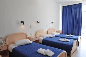Postel nebo postele na pokoji v ubytování Ifigenia Hotel