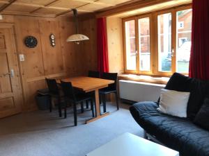 a living room with a table and a couch at Apartment Verena in Vals