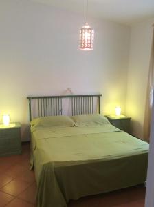 A bed or beds in a room at Villa sul mare Rosa Marina