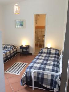 A bed or beds in a room at Villa sul mare Rosa Marina Még 37 kép