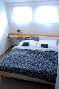 Postel nebo postele na pokoji v ubytování Penzion Pasohlávky