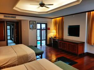 TV o dispositivi per l'intrattenimento presso Wonderland Private Pool Villas at Port Dickson