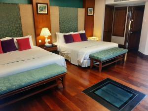 Letto o letti in una camera di Wonderland Private Pool Villas at Port Dickson