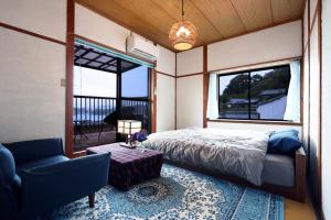 Postel nebo postele na pokoji v ubytování Guesthouse SETOUCHI LIFE