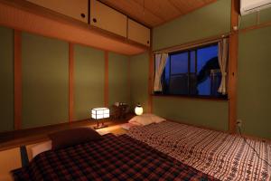 Postel nebo postele na pokoji v ubytování Guesthouse SETOUCHI LIFE