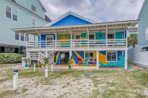 a colorful house with a mural on it at Colorful Murrells Inlet Gem with Outdoor Space! in Myrtle Beach