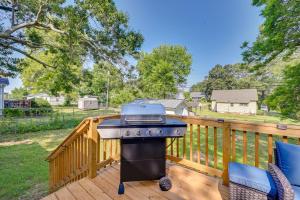 a grill on a deck with a backyard at Updated Greenville Home with Backyard! in Greenville