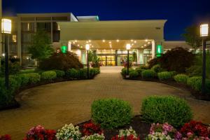 a building with a courtyard with flowers and lights at Holiday Inn Columbia East-Jessup, an IHG Hotel in Jessup
