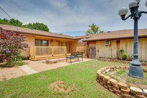 a house with a bench in the yard at Lawton Home with Deck, Near Casinos and Museums! in Lawton