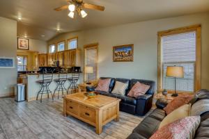 a living room with a couch and a table at Old Mill Lookout in Bend