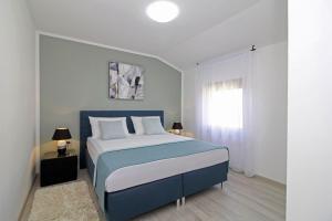 Postel nebo postele na pokoji v ubytování Villa Tina in Pinezići (Haus für 10 Personen)