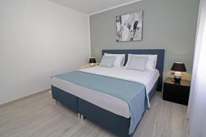 Postel nebo postele na pokoji v ubytování Villa Tina in Pinezići (Haus für 10 Personen)