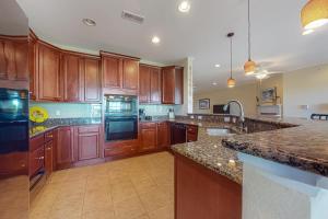 A kitchen or kitchenette at Bayside Resort --- 38415 Boxwood Terrace, Unit #302B
