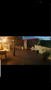 a view of a patio with tables and chairs at Fleet st Property in Baltimore