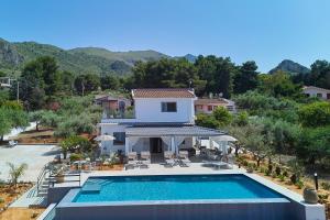 a villa with a swimming pool and a house at Villa Antonella - Pool and Sea view in Castellammare del Golfo