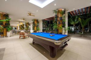 a pool table in the middle of a room at Ocean's Creek Beach Hotel in Balaclava