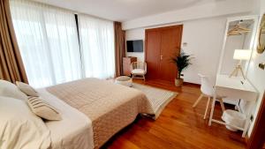 Posteľ alebo postele v izbe v ubytovaní Hotel & Wellness Fra I Pini