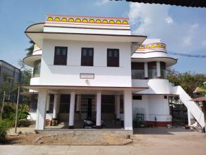 a large white building with a round top at ROYAL STAY VINTAGE in Madurai