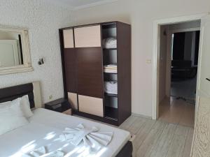 a bedroom with a bed and a closet at Apartment See Breeze in Sunny Beach