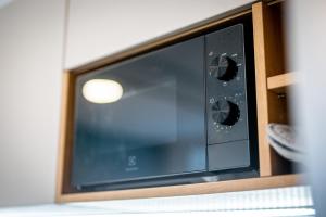 a microwave oven sitting on top of a counter at V srdci města - park - přístav - cyklistické stezky in Strážnice