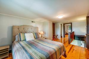a bedroom with a bed and a glass floor at Dobson Farmhouse with Scenic Porch - Near Vineyards! in Dobson