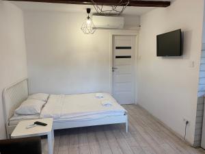 Tempat tidur dalam kamar di Apartament Prosta 2 - studio