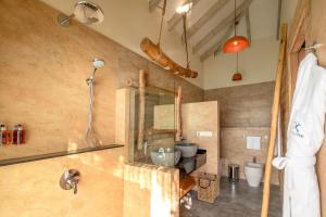 a bathroom with a shower and a sink in a room at You & Me Maldives - Adults Only - Premium All-Inclusive in Raa Atoll