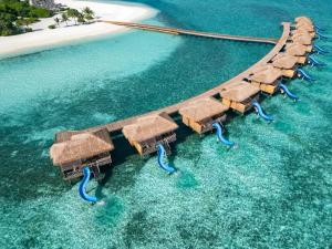 an aerial view of a water slide in the ocean at You & Me Maldives in Raa Atoll