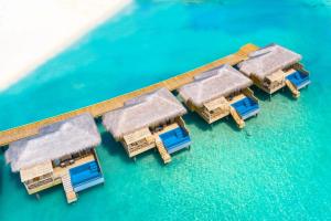 an aerial view of a resort on the water at You & Me Maldives - Adults Only - Premium All-Inclusive in Raa Atoll