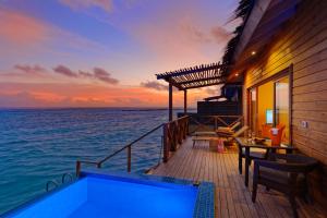 a house on the water with a swimming pool at You & Me Maldives - Adults Only - Premium All-Inclusive in Raa Atoll