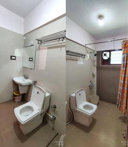 a bathroom with two toilets and a sink at Ganapathy Garden Homestay in Kodaikānāl