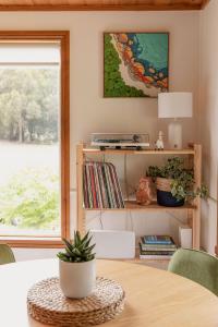 a dining room with a table and a window at Happy Nomad in St Helens