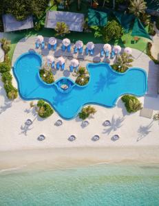 an aerial view of a resort on a beach at You & Me Maldives - Adults Only - Premium All-Inclusive in Raa Atoll