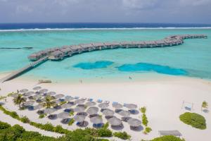an aerial view of a beach with umbrellas and the ocean at You & Me Maldives - Adults Only - Premium All-Inclusive in Raa Atoll