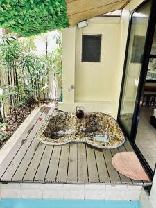 a animal print bath tub sitting on a deck at Ardour Lodge "B" Wing in George Town