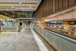 a view of a food hall in a store at Lago Hotel in Side