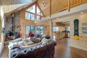 a large living room with a couch and a table at Charming Cabin Near Kirkwood Ski Resort with Hot Tub in Pioneer