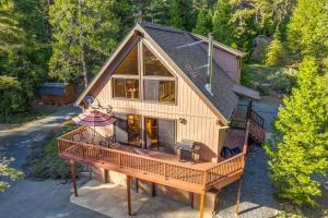 an overhead view of a house with a large deck at Charming Cabin Near Kirkwood Ski Resort with Hot Tub in Pioneer