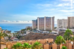 a view of a city with buildings and the ocean at Tenerife Dream 005 in Adeje