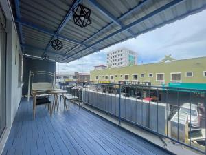 Μπαλκόνι ή βεράντα στο 仙本那镇上民宿-夏之家 Semporna Town Homestay-Summer Home