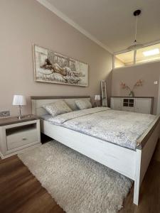 Postel nebo postele na pokoji v ubytování Apartman Teodora