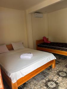 Postel nebo postele na pokoji v ubytování Gihon Bungalow