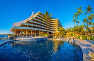 a hotel with a pool in front of a resort at Royal Kona Resort in Kailua-Kona
