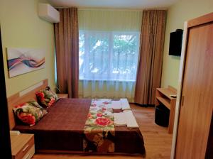 A bed or beds in a room at Apartment Nedyalkov